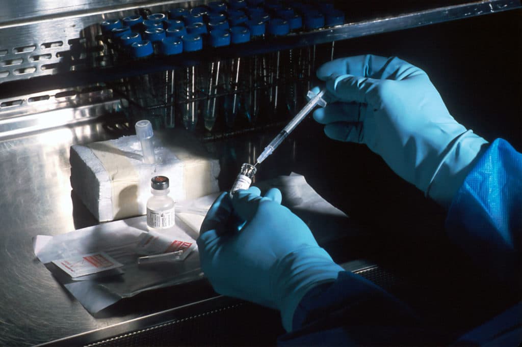 syringe going into test tube