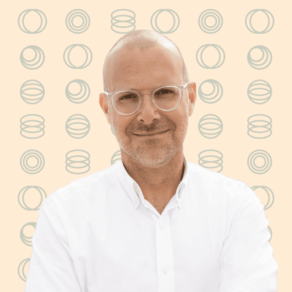 michael bassik headshot with logo background
