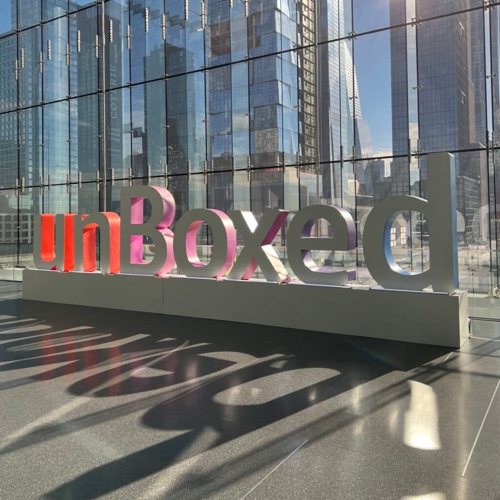 large unBoxed sign with a background of buildings